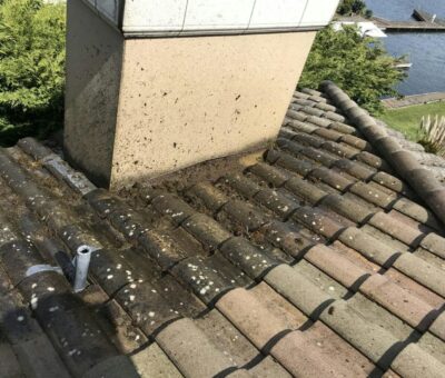 the roof of a house with a pipe sticking out of it